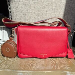 TWELVElittle Peek-A-Boo Crossbody Diaper Bag in red vegan leather